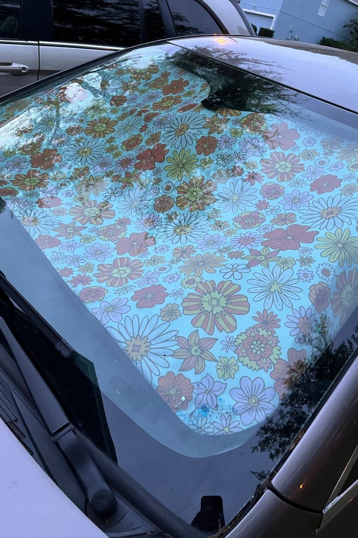 a car with a flower pattern on the windshield