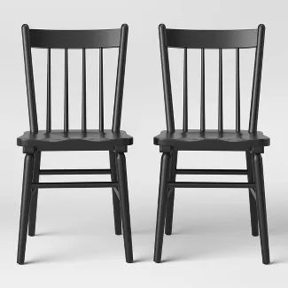 two black wooden chairs side by side