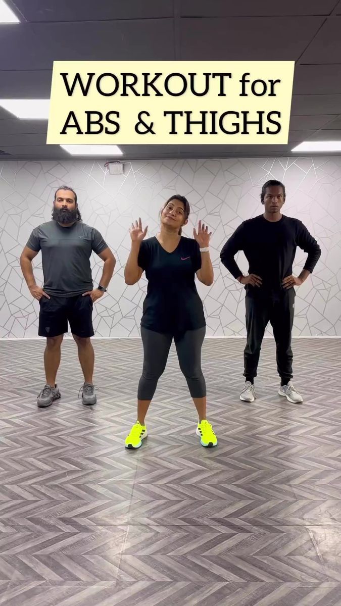 three people standing in front of a sign that says workout for abs and thighs