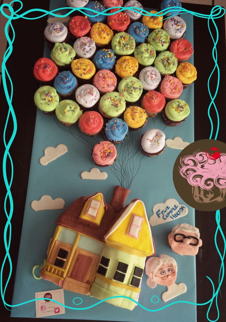 there is a cake made to look like a house and some cupcakes in the shape of a tree