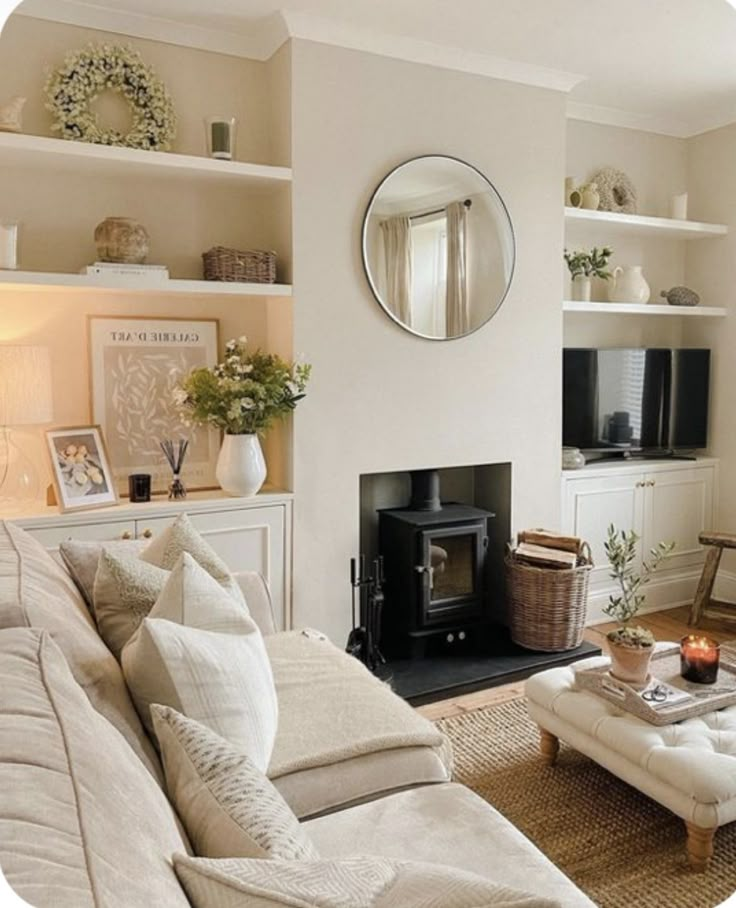 a living room filled with furniture and a fire place