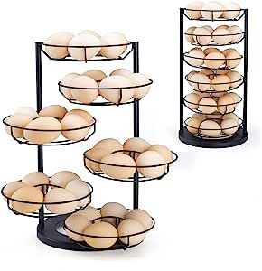 three tiered trays filled with eggs on top of each other in front of a white background