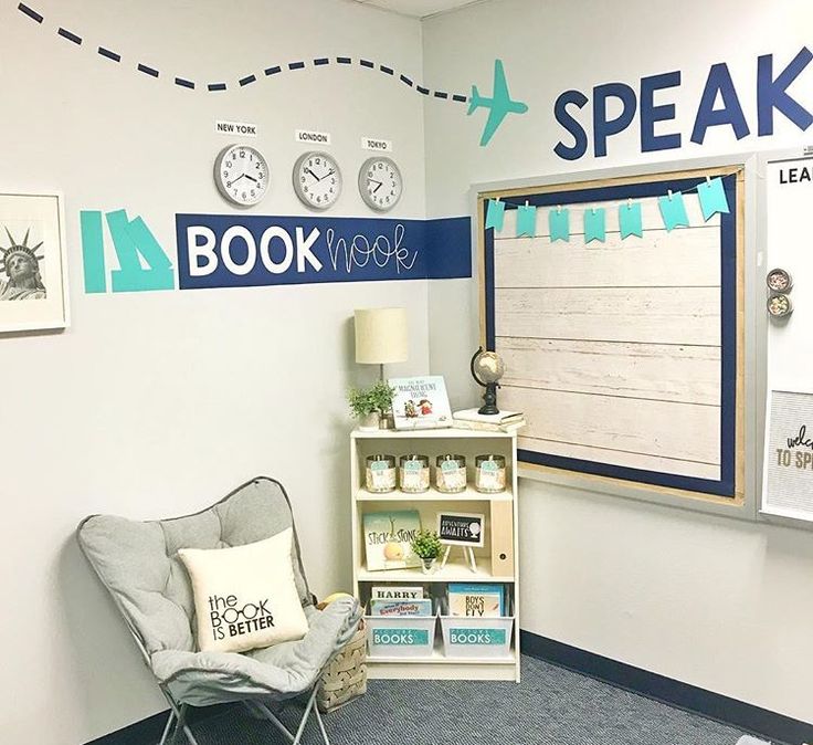 a room with a chair, book shelf and clock on the wall above it that says speak