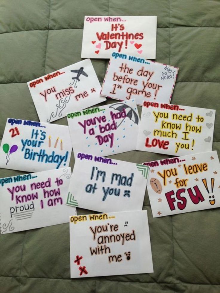 six handmade valentine's day cards laid out on a bed