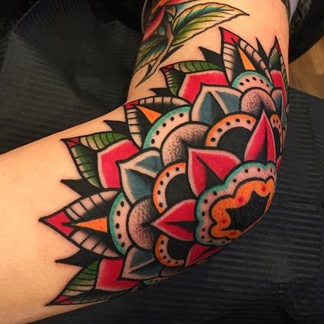 a colorful tattoo on the arm of a woman