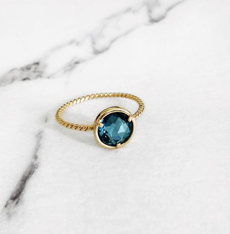 14K London Blue Topaz Engagement ring, Solid Gold Blue Gemstone ring, December birthstone ring, Wedding Promise ring, Rose gold topaz ring, Stacking ring, 14K Promise ring, Wedding jewelry, Boho gold ring, 9K Solid gold ring, FREE EXPRESS SHIPPING Vibrant london blue topaz solitaire ring made in 14K or 9K solid gold. Whisper...I Love Blue! ;) -------------------------------------------------- D E T A I L S 14K Solid Gold or 9K Solid Gold 2ct Rose Cut Round London blue Topaz, 8mm Twisted Band Ban Blue May Birthstone Rings, Blue Emerald Ring For May Birthstone, Round Shape, Blue Emerald Ring For May Birthstone, Blue Emerald Birthstone Ring, London Blue Topaz Engagement Ring, Gold Topaz Ring, London Blue Topaz Engagement Rings, Blue Gemstone Ring, December Birthstone Ring