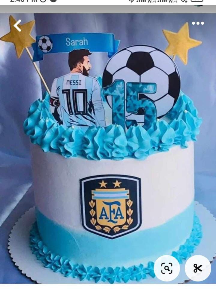 a soccer themed birthday cake with blue icing