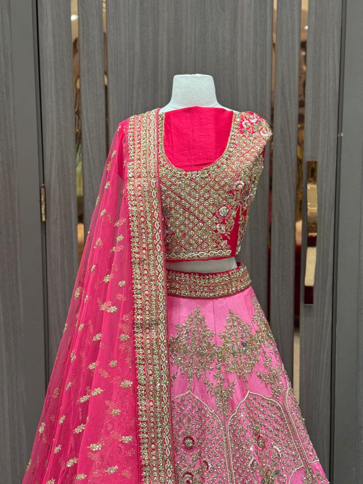 1. Pink ombre raw-silk lehenga features intricate details with multi-color resham, zardozi, sequins, and crystal embroidery. 2. Complete the ensemble with the included hot pink unstitched blouse and Net dupatta 3. Ready to ship ! Pink Lehenga With Resham Embroidery, Fushia Pink Lehenga, Luxury Pink Lehenga With Embroidered Border, Pink Semi-stitched Lehenga With Embroidered Border, Pink Lehenga With Embroidered Border, Raw Silk Lehenga, Crystal Embroidery, Ombre Pink, Pink Lehenga