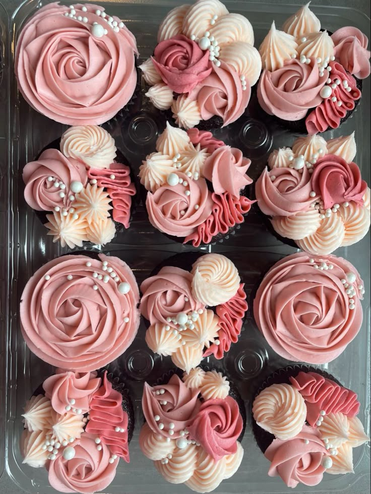 cupcakes decorated with pink and white frosting