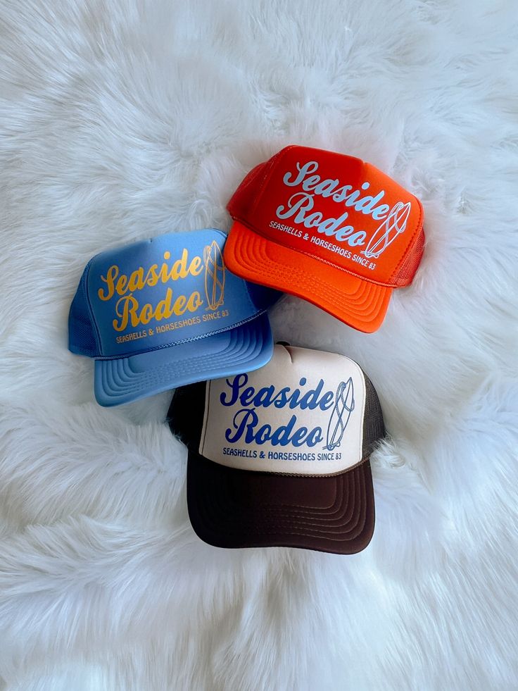 Customizable high crown, foam, mesh/adjustable backing trucker hat detailed with "Seaside Rodeo" design in a color of your choice! Hats shown in listing picture: (Top) Orange hat, baby blue design (Middle) Light blue hat, mustard yellow design (Bottom) Brown/tan hat, royal blue design One size fits most. Royal Blue Design, Orange Hat, Tan Hat, Orange Hats, Yellow Design, Blue Hat, Blue Design, Mustard Yellow, Trucker Cap