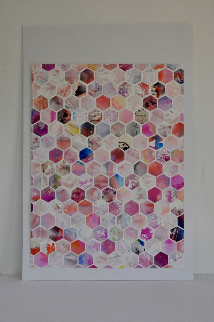 an art work with hexagonal tiles on the wall in front of a white background