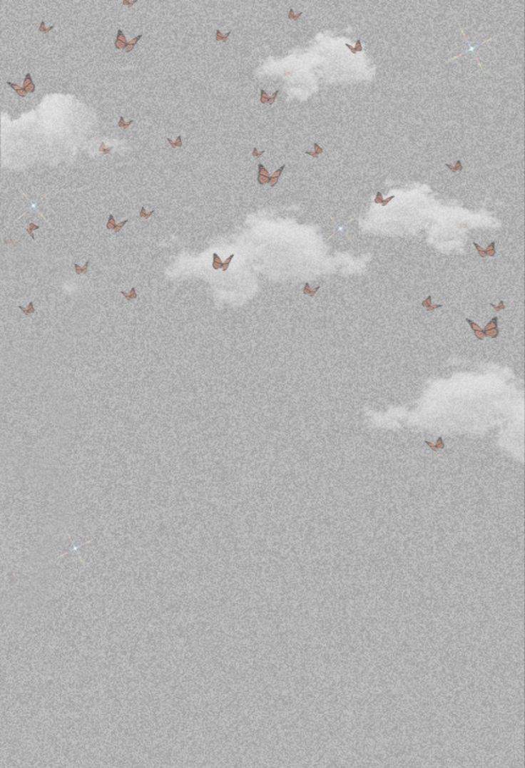 there are many butterflies flying in the sky