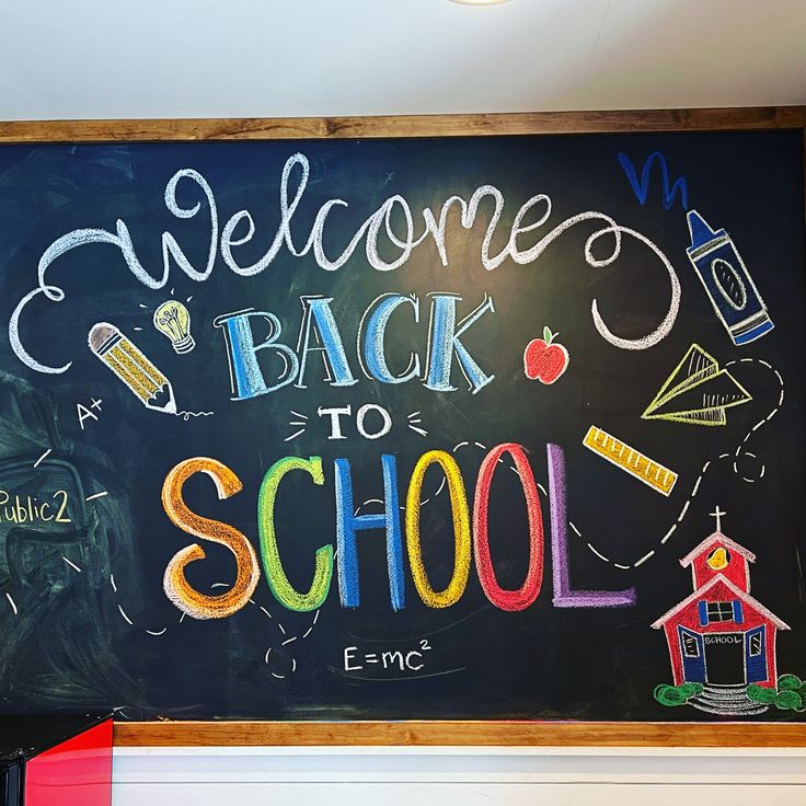 a welcome back to school sign on a blackboard