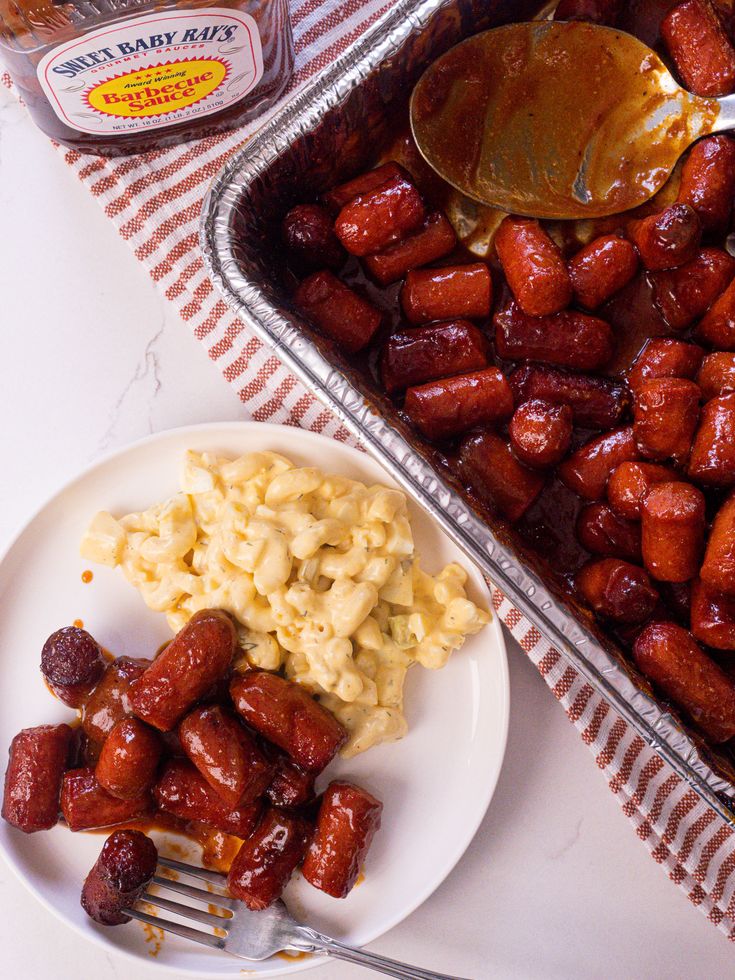 a plate of food next to a pan of macaroni and cheese