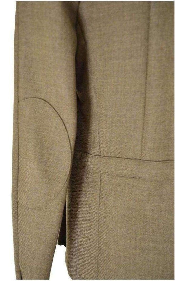 This khaki-green gabardine jacket is a streamlined take on a utility style with padded shoulders – a signature of the house – hidden front button closure, and flap-front pockets.Main - 100% Wool Lining - 100% Cotton Made in FranceSize FR48 - S Shoulder to shoulder 17" Pit to pit 19.5" Waist 36" Length 27.5" Size FR50 - M Shoulder to shoulder 18" Pit to pit 20.5" Waist 37" Length 27.5" Classic Khaki Utility Jacket With Lapel Collar, Khaki Single-breasted Utility Jacket With Lapel Collar, Khaki Utility Jacket With Lapel Collar For Work, Fall Khaki Blazer With Flap Pockets, Classic Solid Utility Jacket With Welt Pockets, Solid Utility Jacket With Flap Pockets For Work, Military Style Blazer With Flap Pockets For Work, Olive Outerwear With Patch Pockets For Work, Classic Olive Blazer For Fall