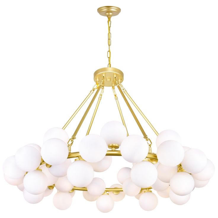 a chandelier with white glass balls hanging from it's golden finish frame