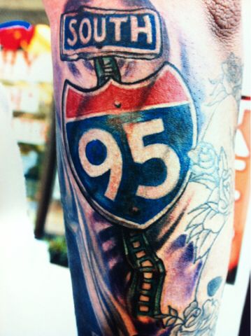 a close up of a person's arm with a tattoo on it that says south 95