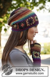 a woman wearing a multicolored knitted hat and mittens