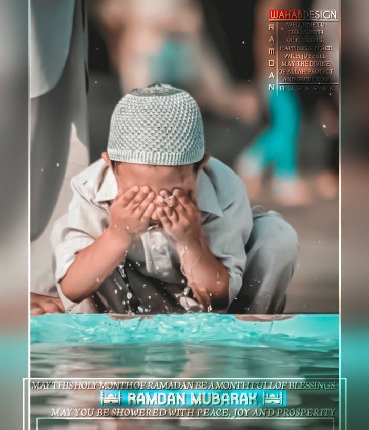 a young boy sitting in the water with his hands on his face