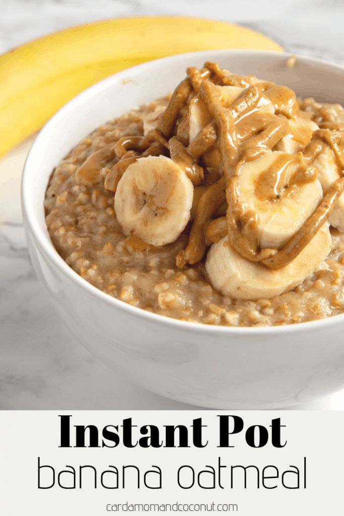 instant pot banana oatmeal in a white bowl with bananas on the side