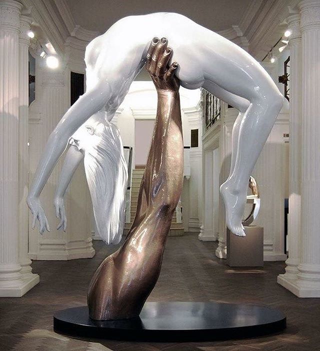 a large white sculpture in the middle of a room