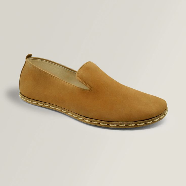 These Cinnamon Clays feature a matte, Nubuck leather that is soft and smooth. The beautiful tan color is a classic that goes well with everything. They feature a wide toe-box and zero-drop design to ensure a perfect, natural fit and a healthy gait. These classic grounding slip-ons are handmade with natural materials that only get better with time and wear. Stay grounded. Brown Suede Slip-ons With Leather Sole, Brown Swift Leather Slip-ons With Textured Sole, Brown Leather Almond Toe Slip-ons, Suede Leather Shoes With Slip-on Fit And Leather Footbed, Everyday Brown Leather Shoes With Textured Sole, Brown Leather Shoes With Textured Sole For Everyday, Leather Slip-ons With Suede Lining And Closed Toe, Classic Closed Toe Suede Slip-ons, Classic Suede Closed Toe Slip-ons