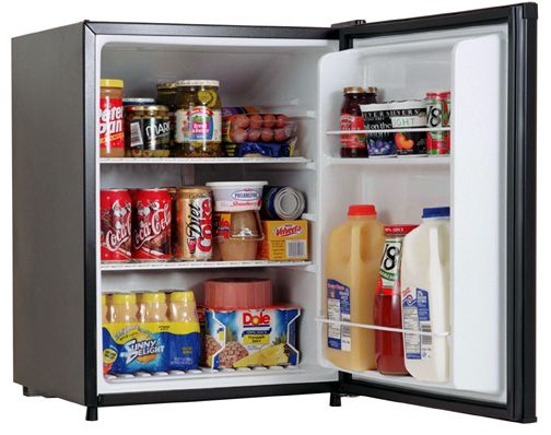 an open refrigerator filled with lots of food and condiments on top of it