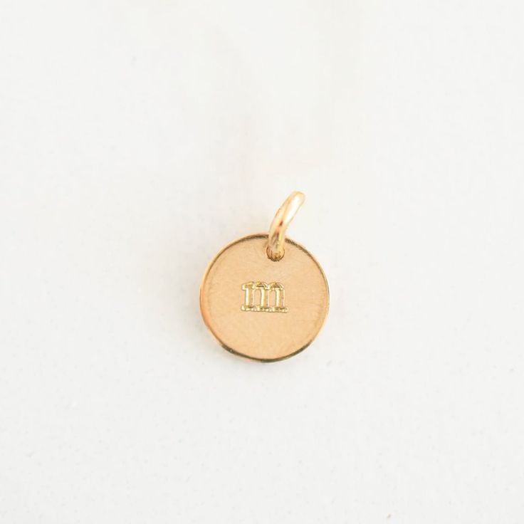 Add a personalized charm to your order to reflect more than one special individual on laurelbox necklaces. These charms may be purchased alone, or added to any necklace we sell. These 9mm charms are engraved with a lowercase or number stamp set. Please note, this listing is for the charm only and does not include a necklace. Minimalist Charm Necklace For Mom, Personalized Dainty Initial Pendant Charms, Dainty Personalized Initial Pendant Charms, Minimalist Round Charms For Gifts, Personalized Small Charms For Gifts, Classic White Gold Charm Necklaces, Minimalist Round Gift Charms, Initial Pendant Charms For Personalized Gift, Everyday Engraved Charm Necklace With Round Pendant