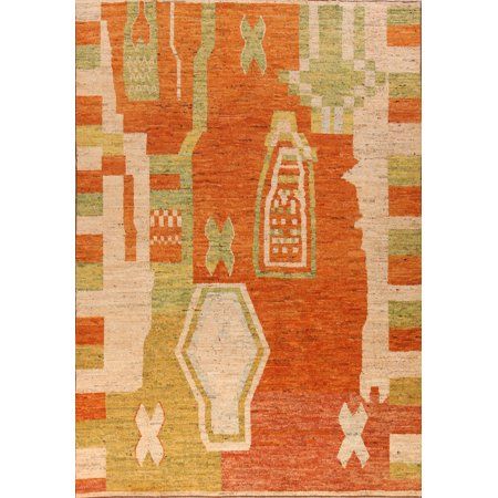 an orange and green rug with various shapes