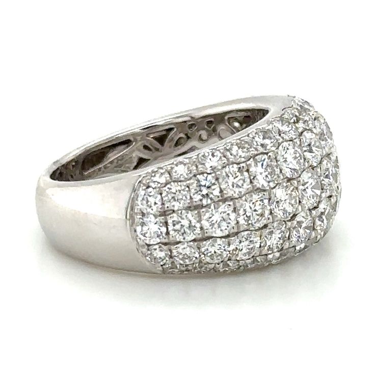 This exquisite five row pave diamond right-hand statement ring is sure to captivate! Featuring 3.52 carats of sparkling diamonds, this dazzling statement piece will add elegance and sophistication to any look. Make a sophisticated statement with this glamorous and timeless treasure! Metal: 18K White GoldDiamond Shape: 67 Round Brilliant CutDiamond Weight: (67) 3.52ct twBand Width: 12mm Estimated production time is 4 - 5 weeks. For desired ring size please leave us a note at the check out. Timeless Treasures, Sparkle Diamonds, Round Brilliant Cut Diamond, Brilliant Cut Diamond, Pave Diamonds, Statement Ring, White Gold Diamonds, Round Brilliant, Diamond Shapes