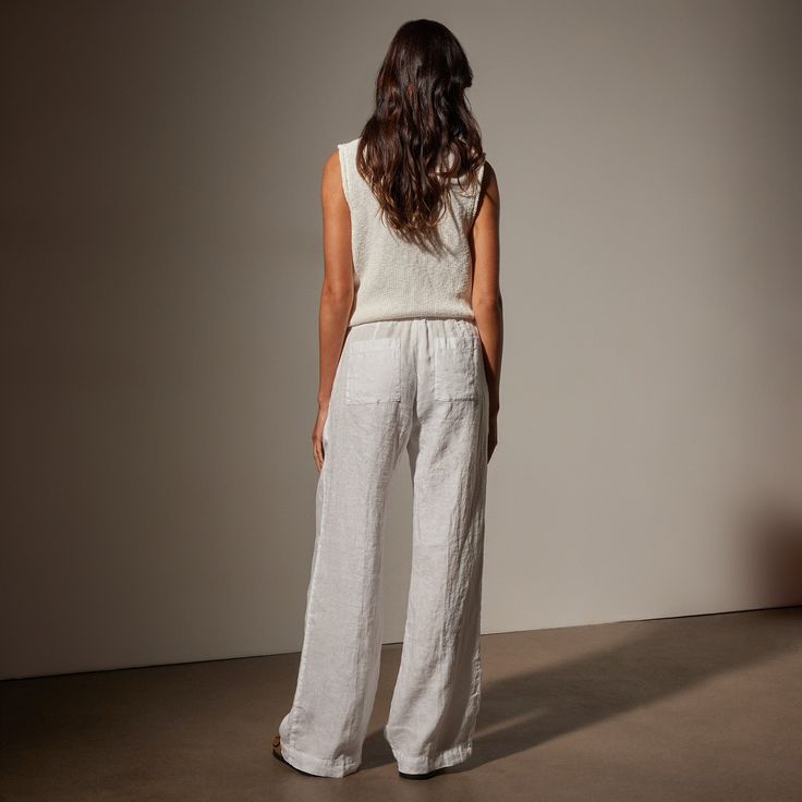 Our Wide Leg Relaxed Linen Pant is made in our classic lightweight linen that is breathable and soft. Style details include narrow jersey waistband with drawcord, front pleats, slash front pockets, back pockets, back darts, and a clean bottom hem. Garment dyed. Relaxed fit.Additional Information:• 100% Linen • Machine wash cold, tumble dry lowStyled With:• WVP3032 - Cotton Linen V Neck Vest • SWTSU8427 - Women's Suede Buckle Slide Linen Pull-on Pants For Daywear, Linen Pull-on Style Bottoms For Loungewear, Linen Wide-leg Pants For Daywear, Relaxed Fit Linen Pants For Daywear, Linen Pants With Straight Hem For Daywear, Daywear Linen Pants With Elastic Waistband, Linen Pants With Elastic Waistband For Daywear, Relaxed White Linen Bottoms, White Linen Wide Leg Pants With Straight Hem