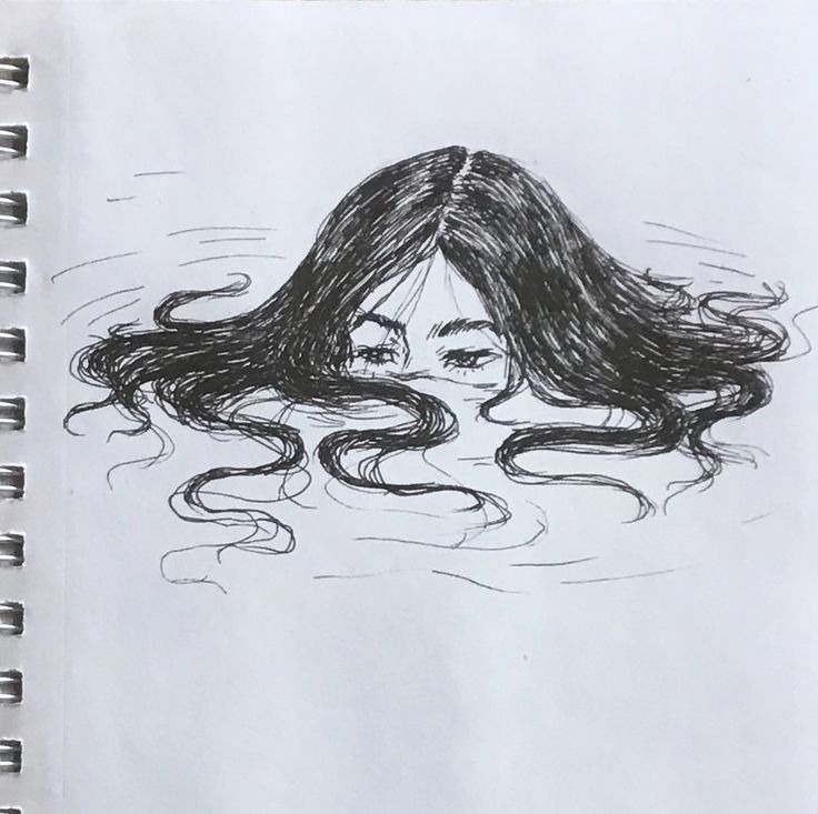 a drawing of a woman's head with long hair floating in the water on paper