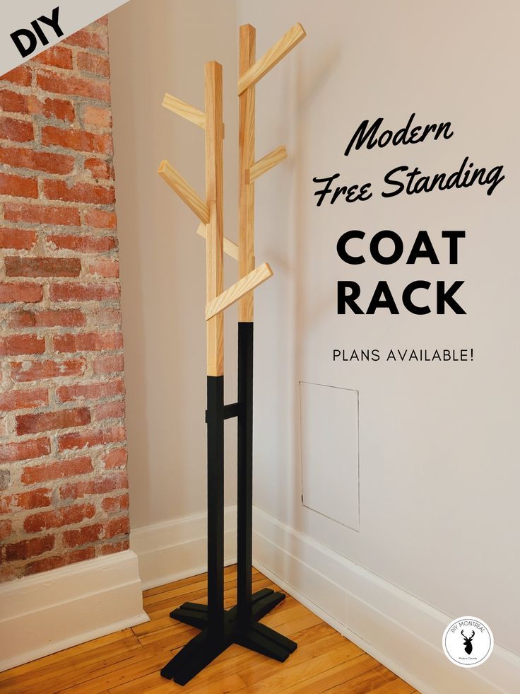 a wooden tree standing next to a brick wall with text overlay that reads modern free standing coat rack plans available