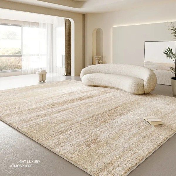 a large white rug in the middle of a room with a mirror and potted plant