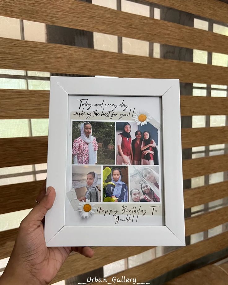 a person holding up a white frame with photos on it and the words happy birthday to you