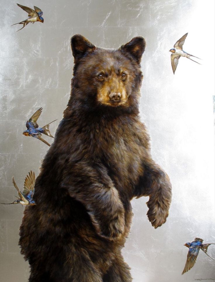 a bear standing on its hind legs in front of birds