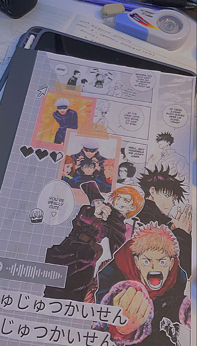 an open book with anime characters on it next to some pens and markers, along with other items