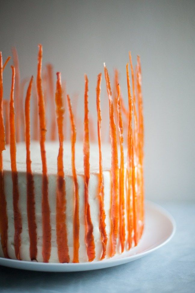 an orange and white cake on a plate