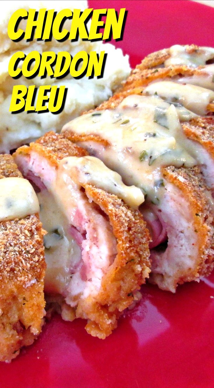 chicken cordon bleu on a red plate with mashed potatoes