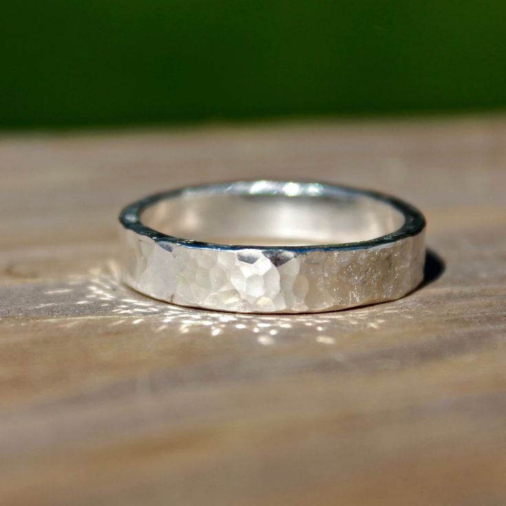 These Hammered bands in silver are perfect for Wedding bands or everyday wear. Great for Men and Women, these bands are handmade to order in your size using traditional metal smithing techniques. I have given the ring a lightly hammered textured finish for a classic yet rustic look with a high shine finish. Measures: 5mm Photos show High Shine and three rings to show how each ring is a little unique! Material: Silver (.925). All materials are hypoallergenic. These Rings are designed and handcraf Hammered Man Ring, Silver Rings For Women Band, Hammered Silver Ring Men, Hammered Silver Wedding Band, Men's Rings Silver, Silver Ring Design For Men Unique, Metal Rings For Men, Best Ring For Men, Wedding Ring For Men Silver