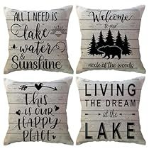 four pillows with different sayings on them