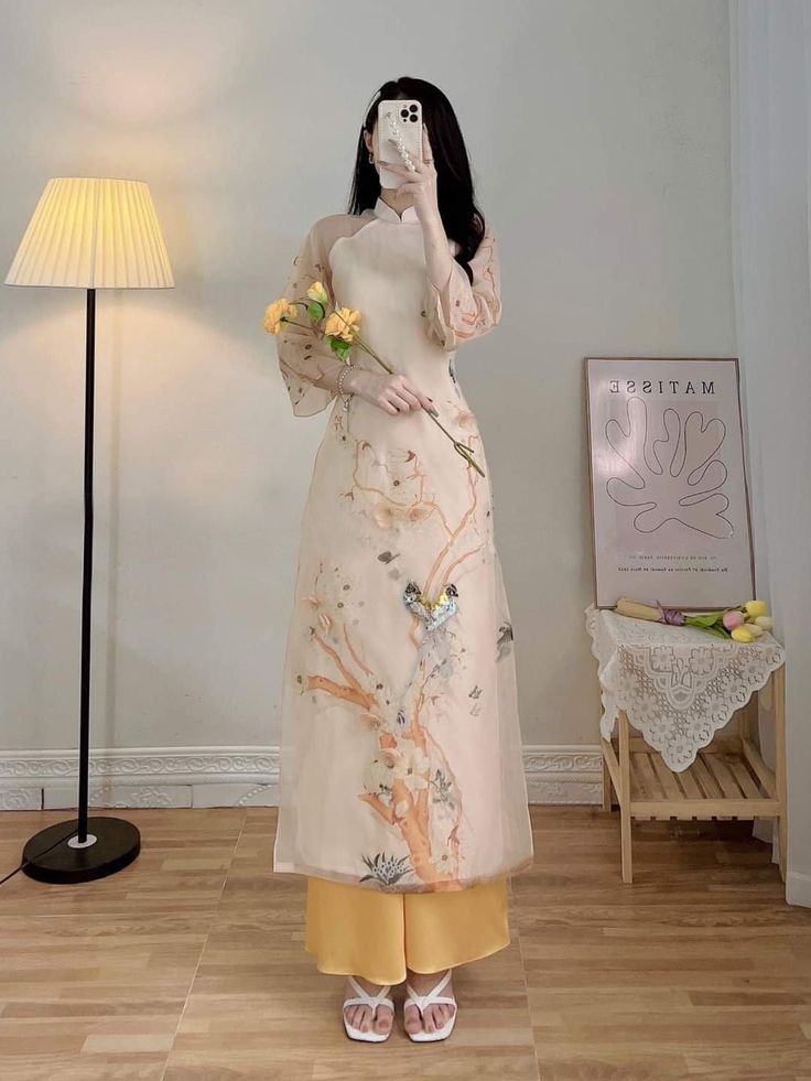 "🌿 This set includes traditional Ao Dai, pants. Style: Traditional Material: Very well made with high-quality silk with double layers Collar: low collar Please provide bust-waist-and hip measurements when placing your order to ensure the best fit for you. 🌿 NOTE: * Recommend gentle washing * Please contact us for any inquiries about size. We don't have an exchange policy for the wrong size * It is safe for a washer and dryer in a \"delicate\" setting. * Actual Ao Dai colors may differ up to 10% due to lightning and viewing devices. * These ao dai pants are made based on Vietnamese size; they will run smaller than American size. 🌿 Return and Exchange Policy: I do not accept cancellations, returns, and exchanges. However, for a special case, I can exchange the size of that /ao dai when av Gaun Tulle, Wedding Ao Dai, Vietnamese Ao Dai, Vietnamese Dress, Chiffon Fashion, Kinds Of Clothes, Lace Design, Traditional Dresses, Traditional Outfits