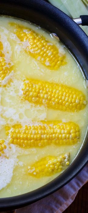 corn on the cob being cooked in a skillet