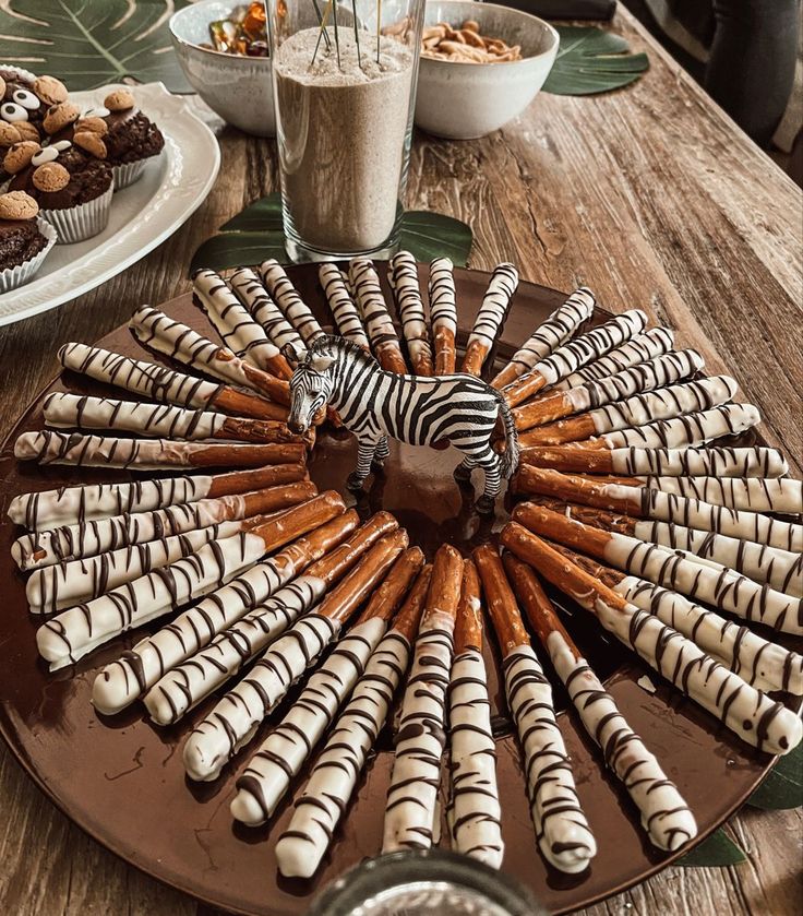 there is a plate with zebra cookies on it