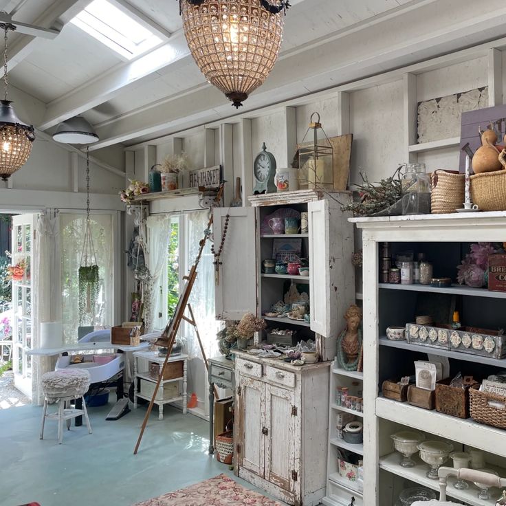 a room filled with lots of different types of furniture and decor on top of shelves