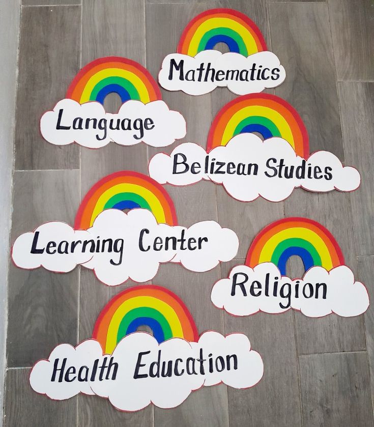 four rainbows with different languages on them sitting on the floor next to each other