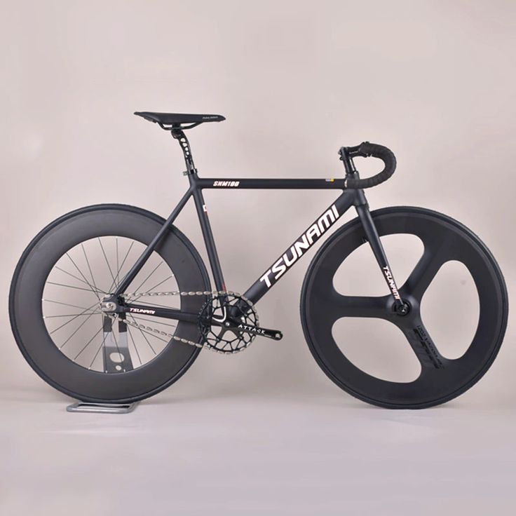 a black bike with wheels and spokes is shown in front of a white background