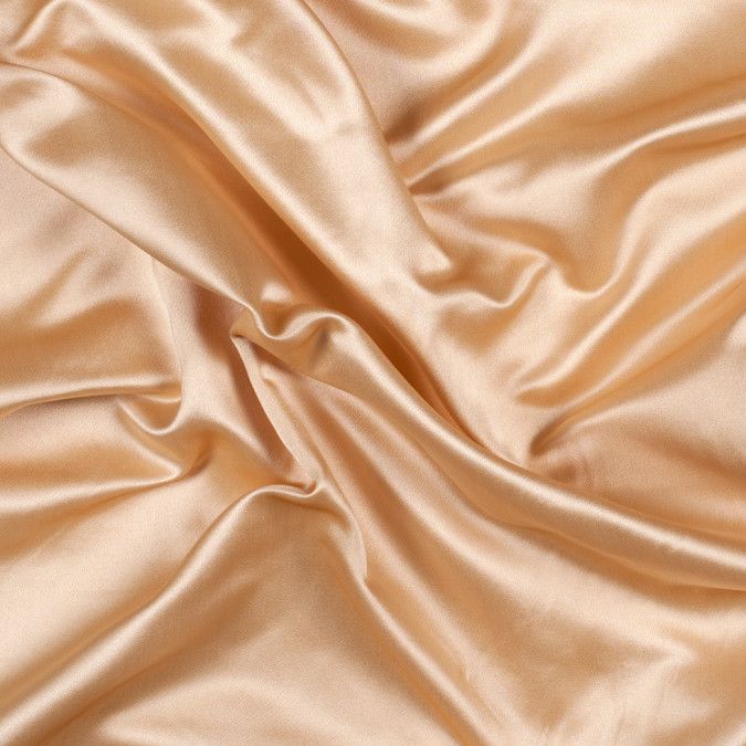 a close up view of a tan satin fabric