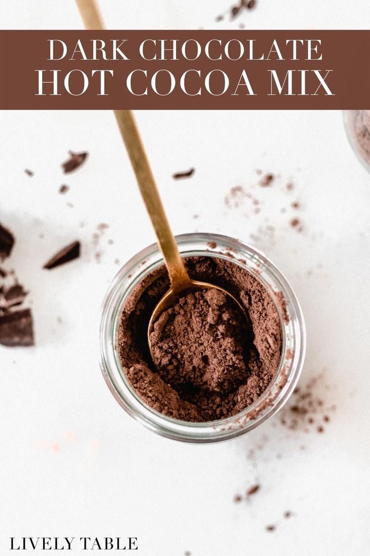 chocolate hot cocoa mix in a glass jar with a spoon on the side and text overlay that reads dark chocolate hot cocoa mix