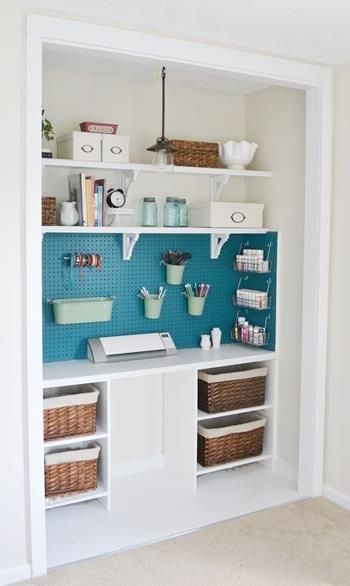 a room with some shelves and baskets on the wall next to each other in it